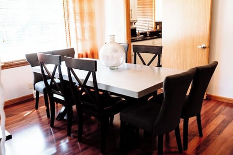 Setting the stage for shared moments and delicious meals. The perfect space for an intimate dinner or lively conversation. Located just steps away from the kitchen, culinary delights are easily served with convenience