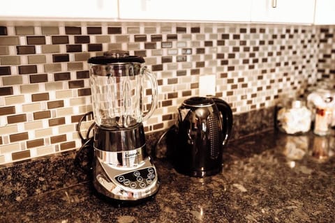 A blender for refreshing smoothies and a hot water electric kettle for quick and convenient hot beverages