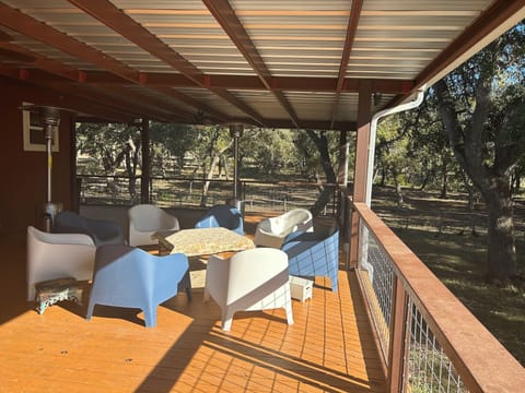Outside deck with picnic table and outdoor ceiling fans