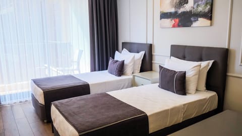 Deluxe Double or Twin Room, City View | Premium bedding, minibar, in-room safe, blackout drapes