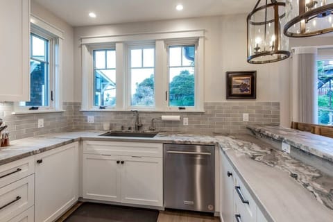 Kitchen with Stockton Ave bridge view and Kitchen Aid suite appliances. 