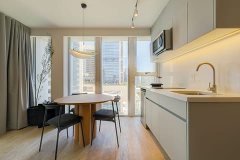 Luxury Apartment, Balcony, City View | Private kitchen | Full-size fridge, microwave, stovetop, dishwasher