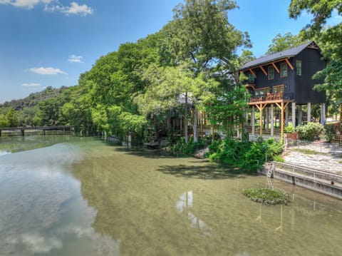 Exclusive Three-Story Treehouse Retreat Offering Panoramic River Views