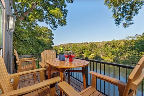 Enjoy breathtaking views from the expansive main-level deck at the Black House, complete with ample seating, perfect for relaxing and soaking in the scenery.