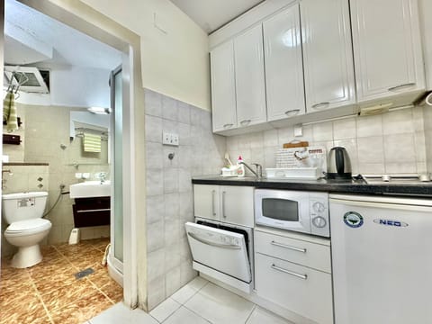 Comfort Apartment, Sea View | Private kitchen | Fridge, microwave, stovetop, dishwasher