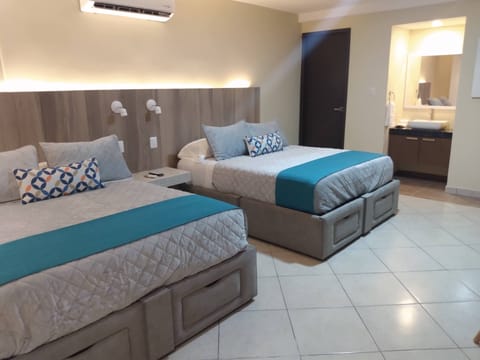 Deluxe Quadruple Room | Egyptian cotton sheets, premium bedding, down comforters, minibar