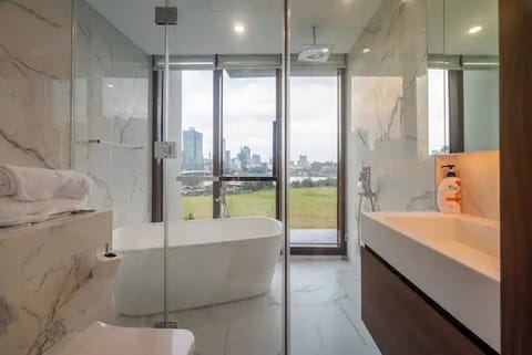 Family Suite, 4 Bedrooms, Pool Access, City View | Bathroom | Combined shower/tub, hydromassage showerhead, designer toiletries