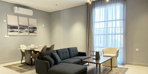 Design Apartment, 3 Bedrooms | Living area | Flat-screen TV