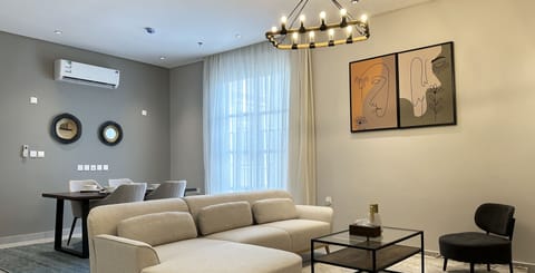 Design Apartment, 3 Bedrooms | Living area | Flat-screen TV