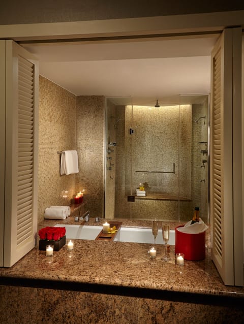 Luxury Suite, 1 King Bed | Bathroom | Combined shower/tub, free toiletries, hair dryer, bathrobes