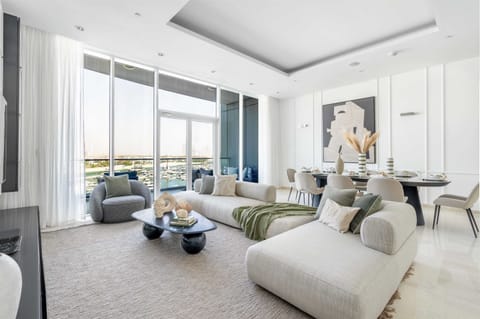 Stunning open plan lounge with floor to ceiling windows and sea view