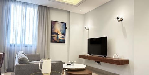 Design Apartment, 3 Bedrooms | Living area | Flat-screen TV