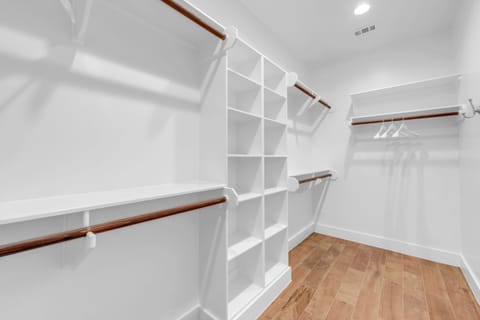Voluminous Master walk-in closet