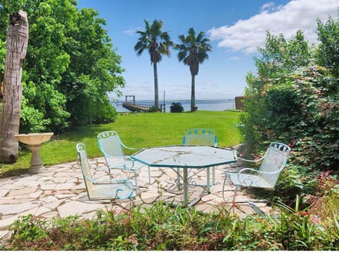 table and 4 chairs on ground level for sitting and conversations