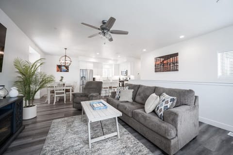 Upstairs living room with pull out queen sofa bed, fireplace and smart tv.