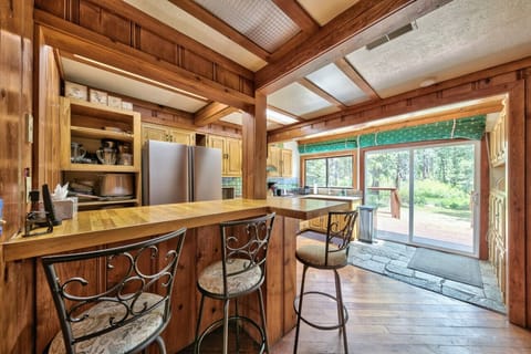 Nicely appointed kitchen in center of home and opens to back deck.