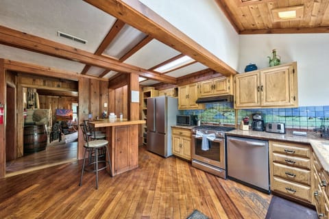 Nicely appointed kitchen in center of home and opens to back deck.