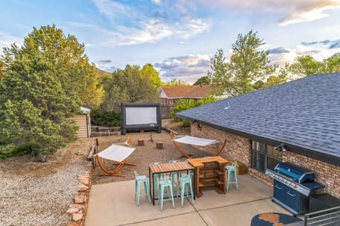 Outdoor movie theater with bbq and many patio areas
