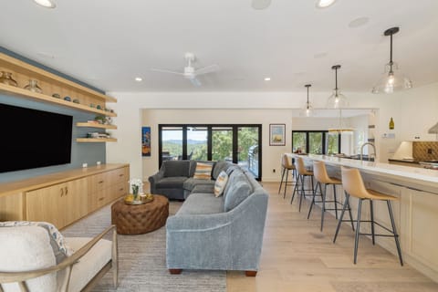An open floor plan connects the second living area and the kitchen.