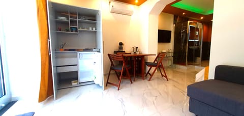 Junior Apartment, Garden View | Living area | 42-inch Smart TV with digital channels