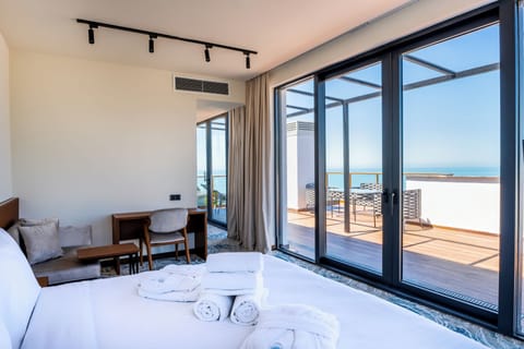 Junior Suite, Sea View | Premium bedding, minibar, in-room safe, individually decorated