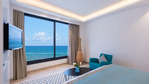 Executive Room, 1 King Bed, Beach View | Living area | 33-inch LCD TV with satellite channels, TV