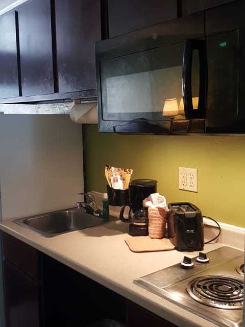 Fridge, microwave, stovetop, coffee/tea maker