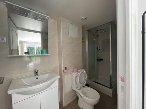 Signature Suite | Bathroom | Shower, hair dryer, towels, soap