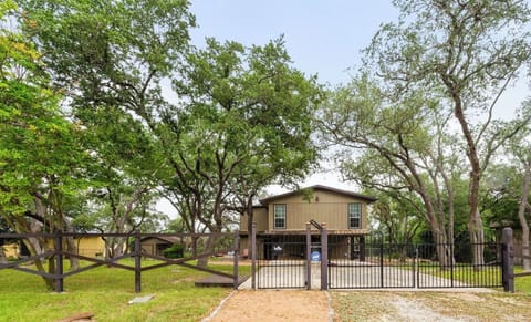 At the front of the house: gated entrance with plenty of parking.