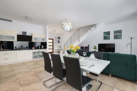 Living room with dining table and chairs.