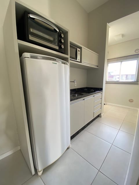 Deluxe Apartment, Sea View | Private kitchen | Fridge, microwave, oven, stovetop