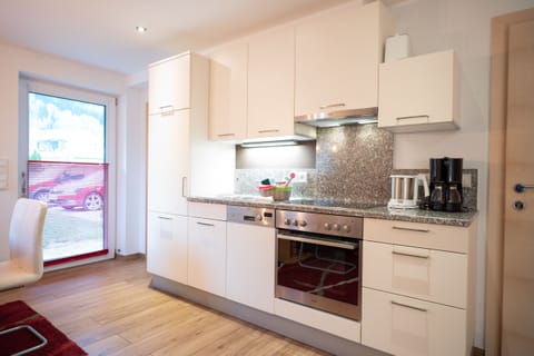 Deluxe Apartment | Private kitchen | Fridge, oven, stovetop, espresso maker