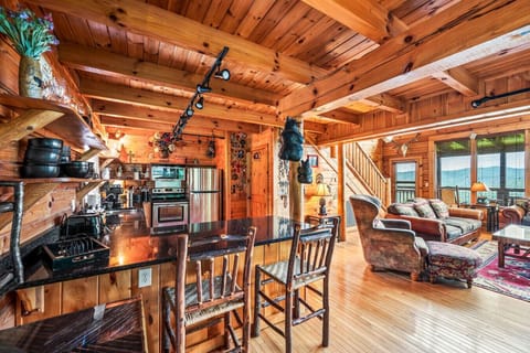 There are two bar stools located at the kitchen counter for additional seating space.
