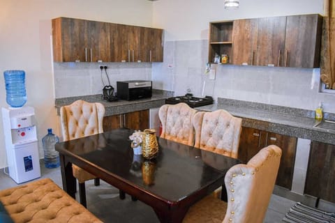 Comfort Apartment | Private kitchen | Fridge, microwave, cookware/dishes/utensils, dining tables