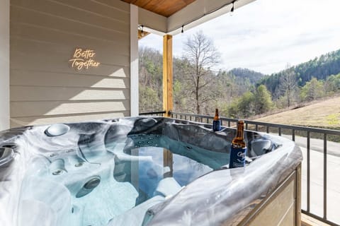 Soak in the hot tub on the large deck while taking in panoramic views of the surrounding natural beauty. - The Regal - Sevierville, TN