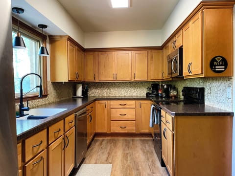 Kitchen - includes cooking utensils, pots, pans, etc. Oh did I mention there is a Nespresso maker with pods provided? And a coffee bar?!