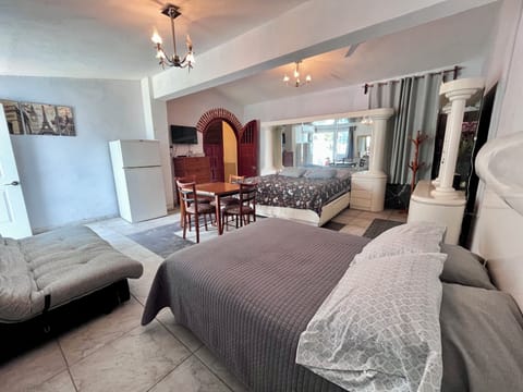 Deluxe Room, Multiple Beds, Smoking, Garden View | Down comforters, free WiFi