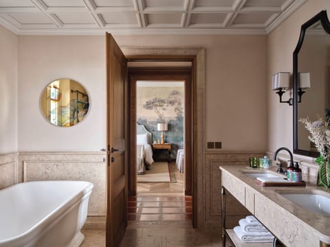 Separate tub and shower, hair dryer, bathrobes, slippers