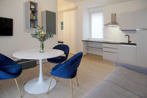 Family Apartment, Balcony, Partial Lake View | Living area | 32-inch flat-screen TV with cable channels