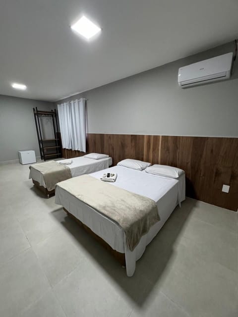 Exclusive Room, Multiple Beds, Courtyard View | Hypo-allergenic bedding, iron/ironing board, free WiFi, bed sheets