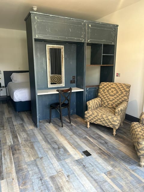 Classic Suite, 1 King Bed, Patio | Living area | 55-inch Smart TV with digital channels, Netflix, streaming services