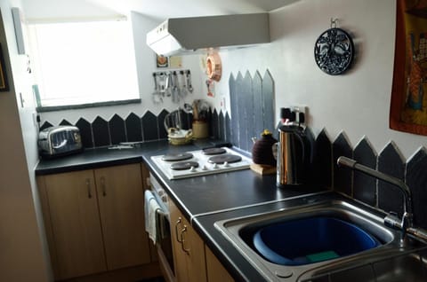 Kitchen at Carni Lodge with sink, cooker, window
