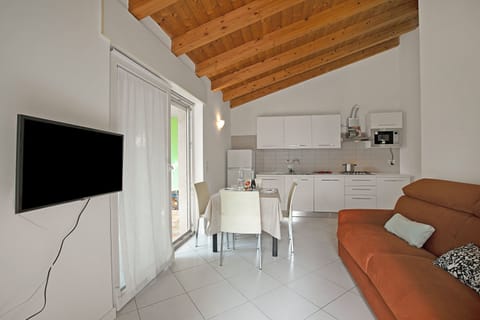 Family House, 2 Bedrooms (Il Giardino di Sara) | Living area | 21-inch flat-screen TV with cable channels, TV