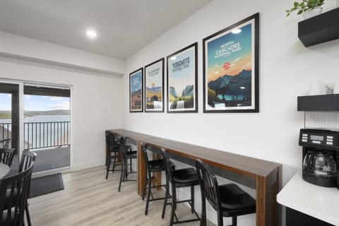 Main Level: Dining room w/ seating for 10 at dining table & seating 9 seatings at bar counters