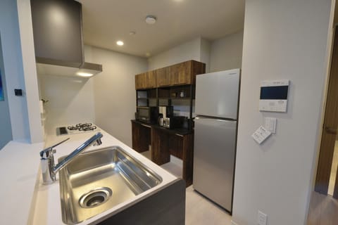 Apartment | Private kitchen | Fridge, microwave, stovetop, rice cooker