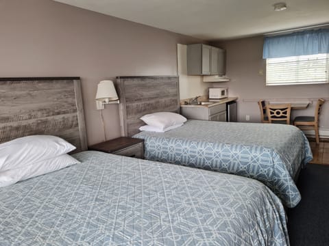 Standard Room, 2 Queen Beds, Kitchen, Courtyard Area | WiFi, bed sheets