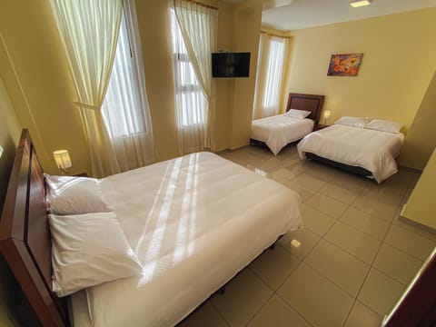 Deluxe Triple Room, Courtyard View | Soundproofing, free WiFi