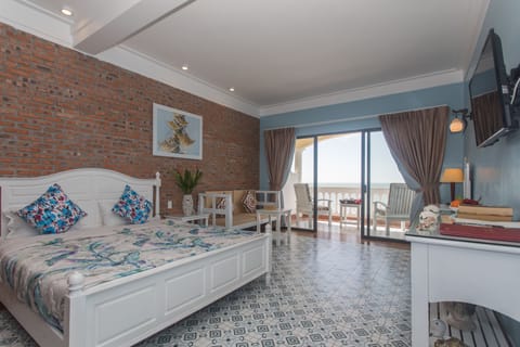 Luxury Suite, 1 King Bed, Ocean View, Oceanfront | 1 bedroom, minibar, in-room safe, individually decorated
