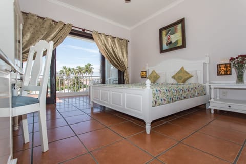 Deluxe Room, 1 King Bed, Partial Sea View | 1 bedroom, minibar, in-room safe, individually decorated