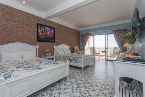 Premier Quadruple Room, Oceanfront | 1 bedroom, minibar, in-room safe, individually decorated